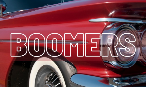 Image of 1950's red car with "Boomers" in foreground